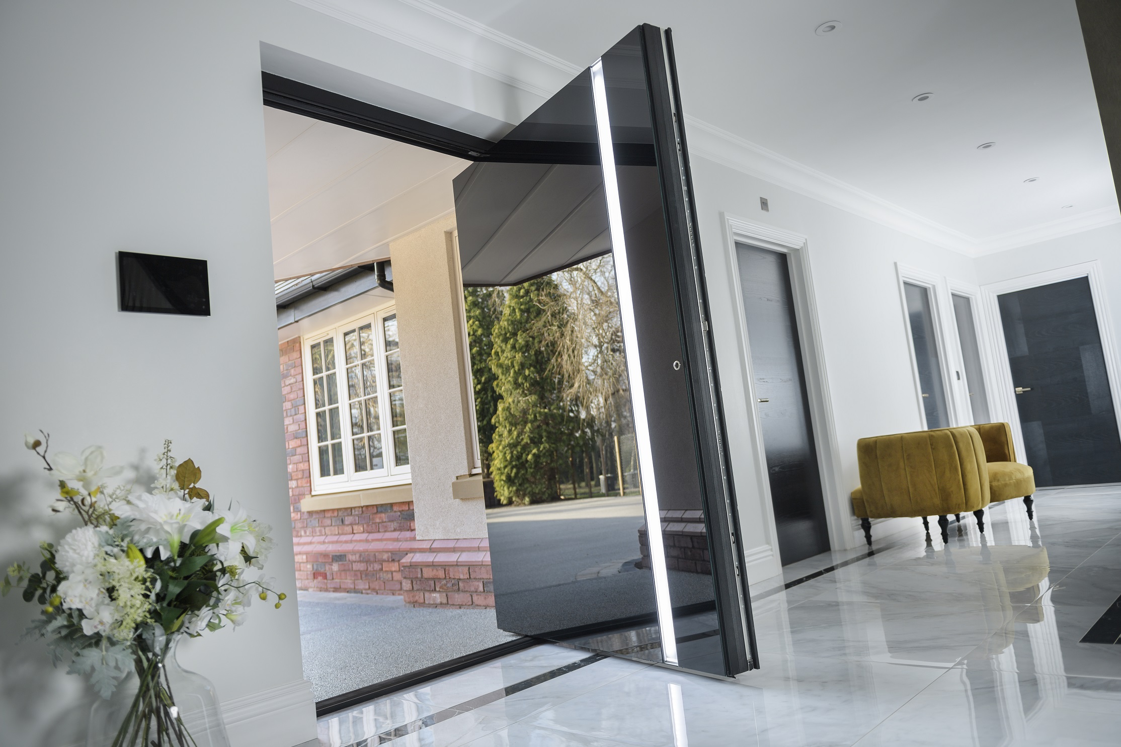Pivot Door with black glass and LED handle